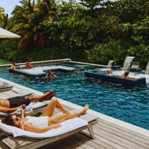 Waldorf Astoria Maldives Ithaafushi Maldives Honeymoon Packages Relaxing By The Pool