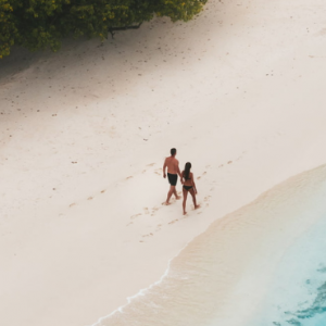 Amilla Fushi Maldives Honeymoon Packages Couple On Beach