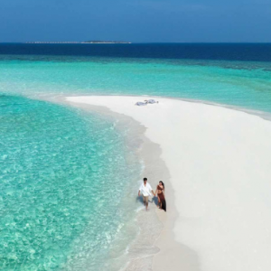 Emerald Faarufushi Resort & Spa Maldives Honeymoon Packages Couple On Beach